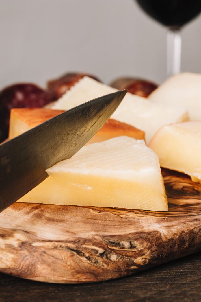 sharp-knife-cutting-cheese